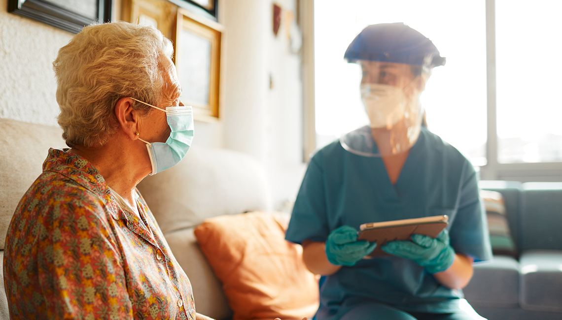 Older Woman Receiving Check Up From Nurse